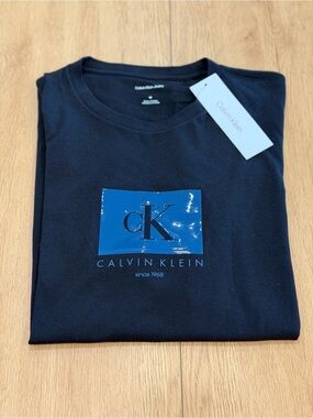 Calvin Klein Jeans Black Short-Sleeve Tee with Blue CK Emblem